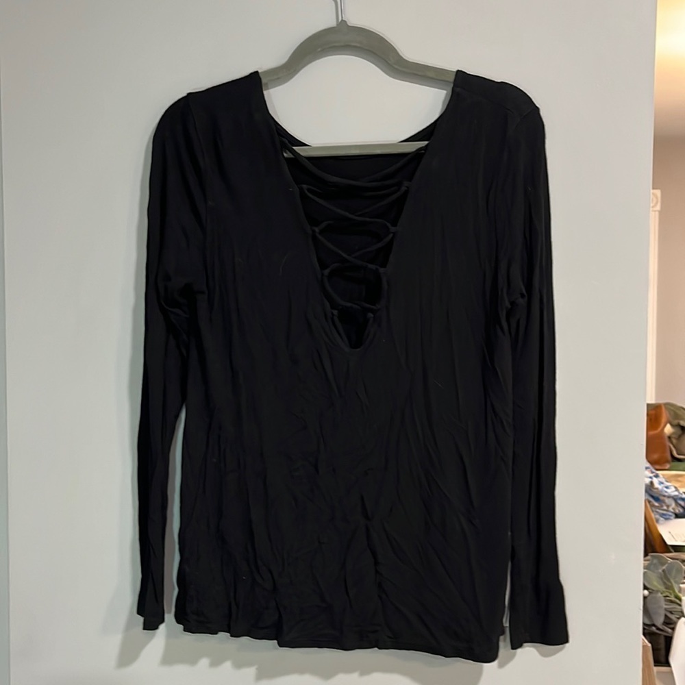 NYTT black long sleeve with open cris cross back